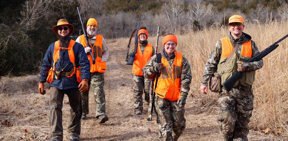 group walking back from bird hunting