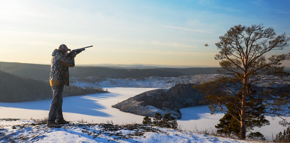 man bird hunting in winter